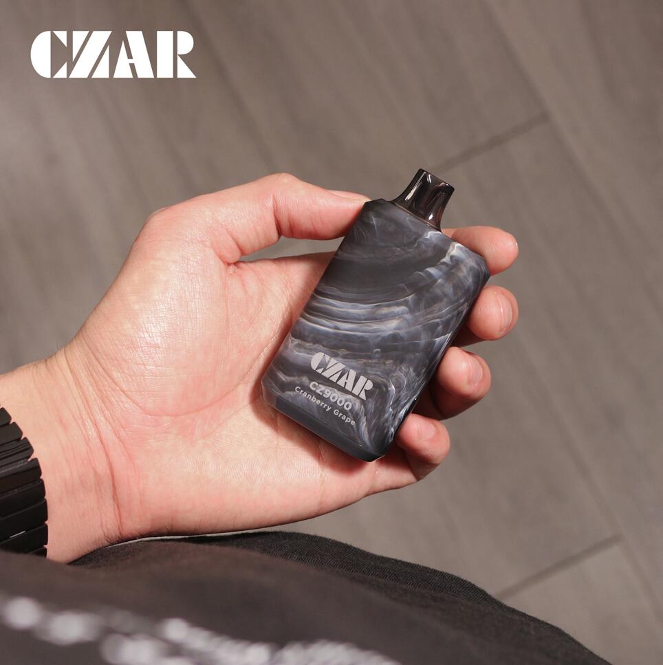 Czar CZ9000 disposable vape in Cranberry Grape flavor, showcasing a premium black marble finish and ergonomic design for comfort and elegance.