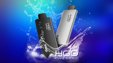 Two  HQD Cuvie Slick devices with liquid splash over blue background