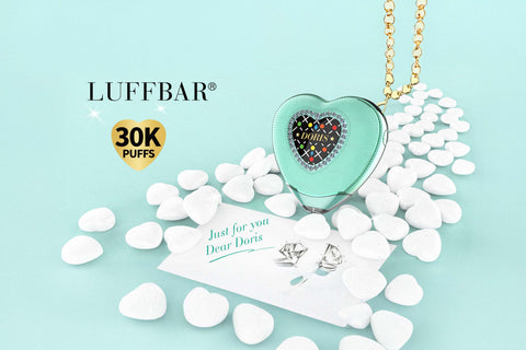 Heart-shaped LUFFBAR product with decorative elements on a light blue background