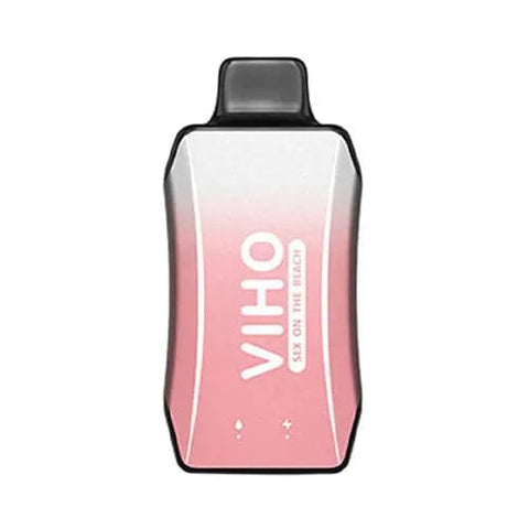 Sleek two-tone pink and white VIHO Turbo vape with ergonomic design on table next to tropical cocktail, featuring rechargeable battery and easy-grip shape for enjoyable Sex On The Beach flavored vaping experience.